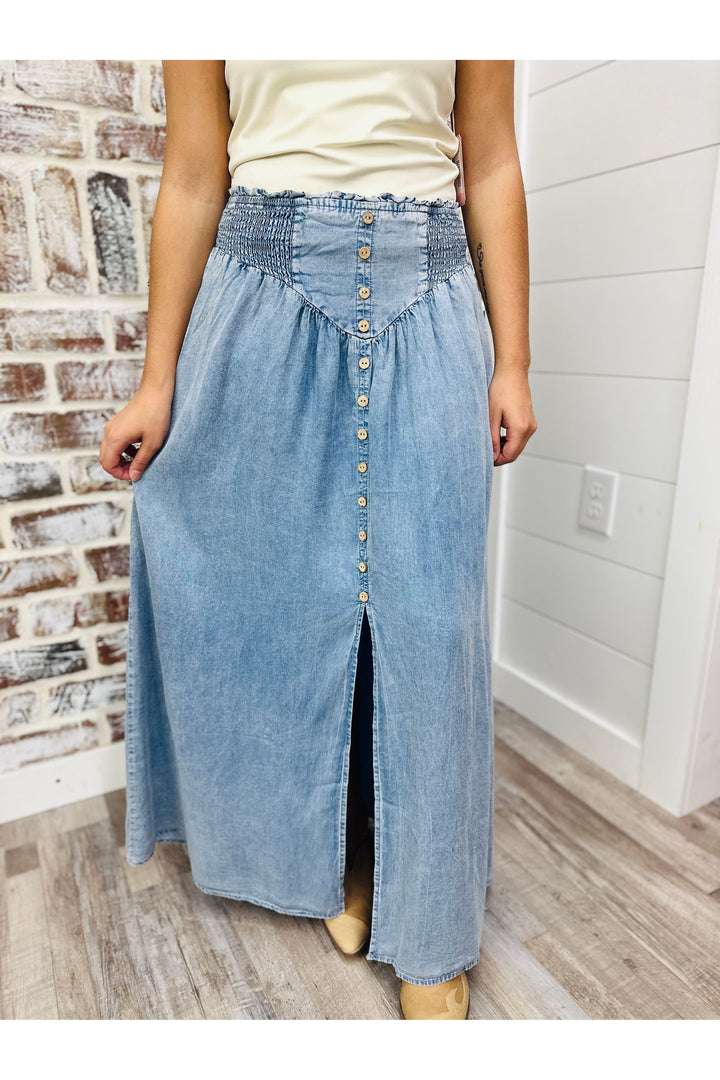 Denim Front Slit Maxi Skirt features a smocked waistband
