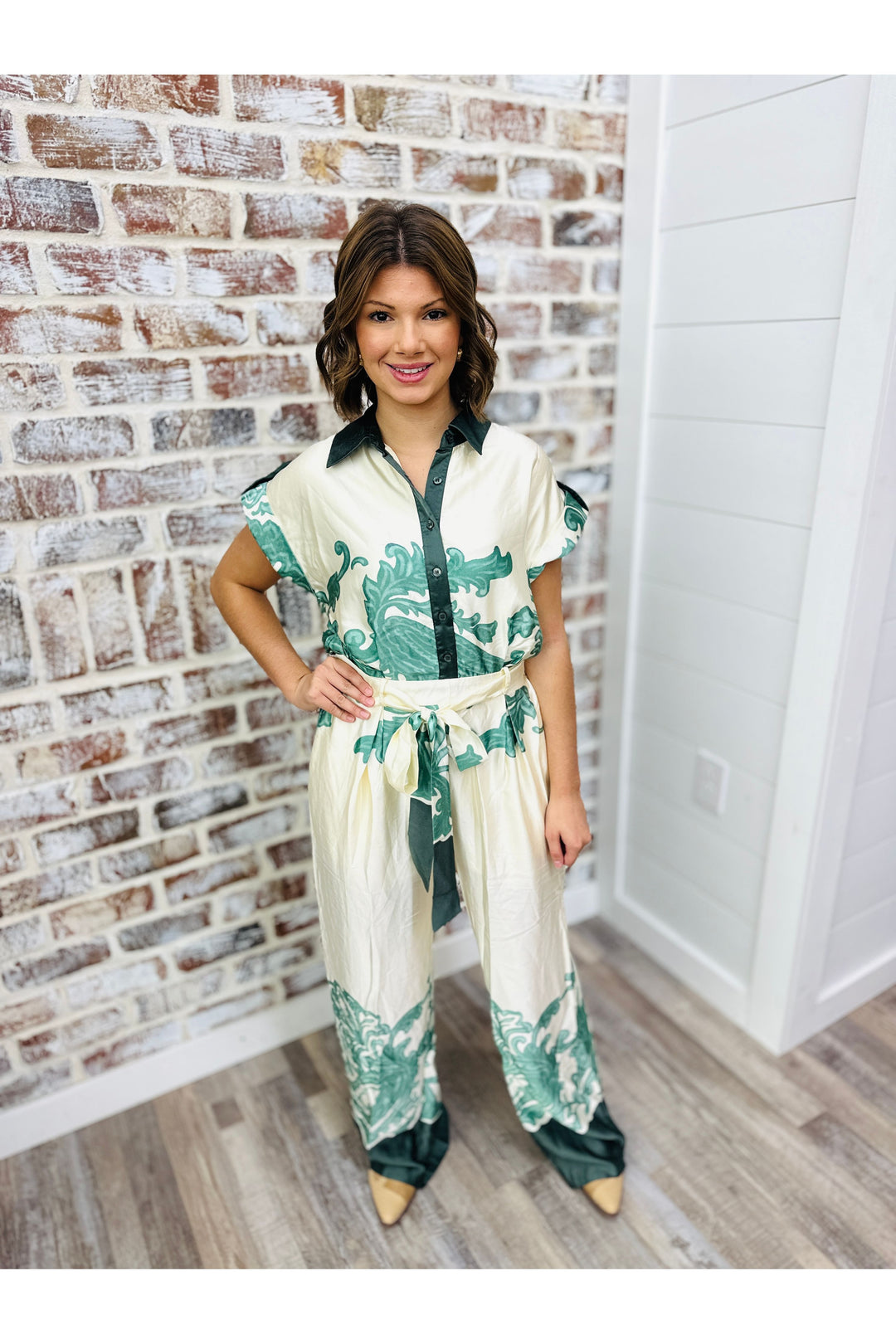 Cream silk jumpsuit with sage color printed designs