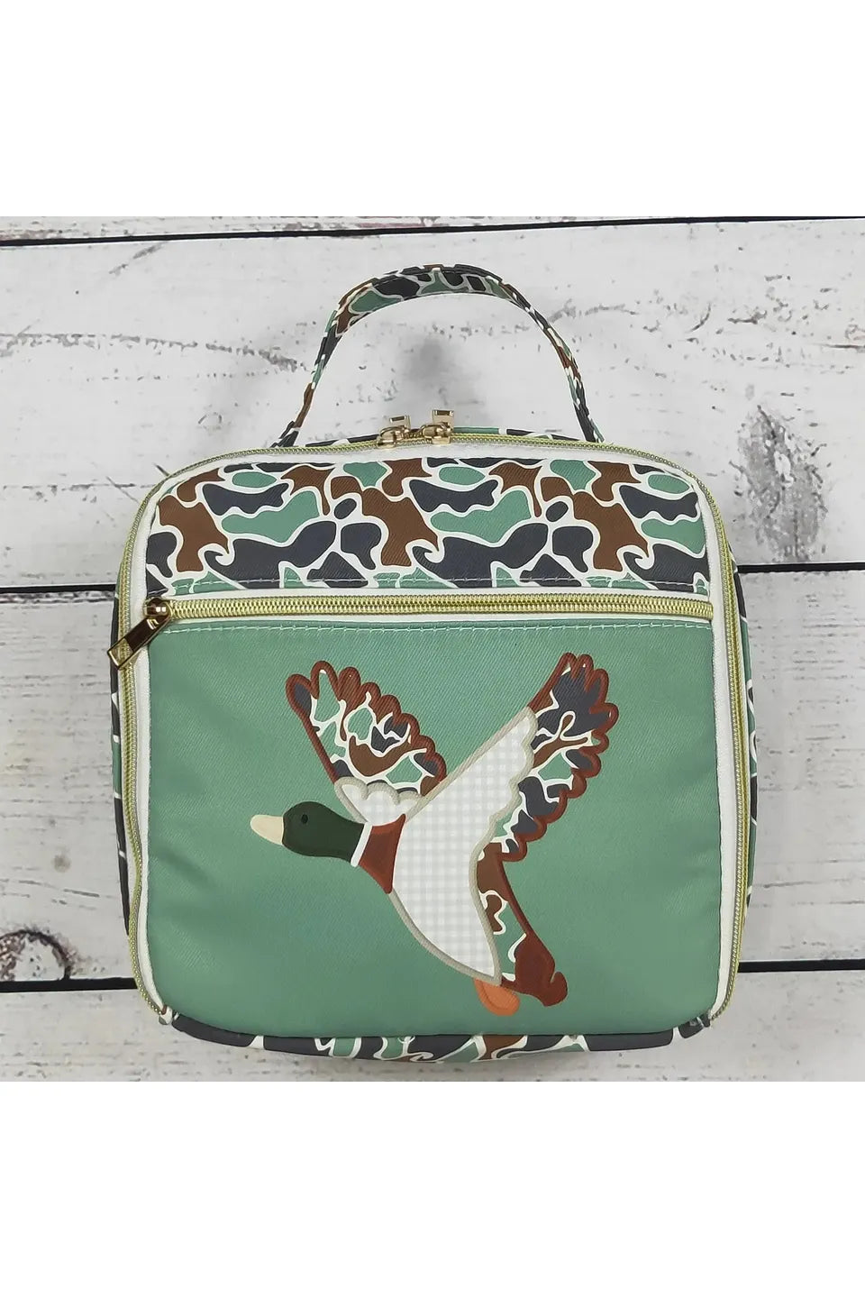 Youth camoflauge lunchbox with olive green detail and patched duck on the front.