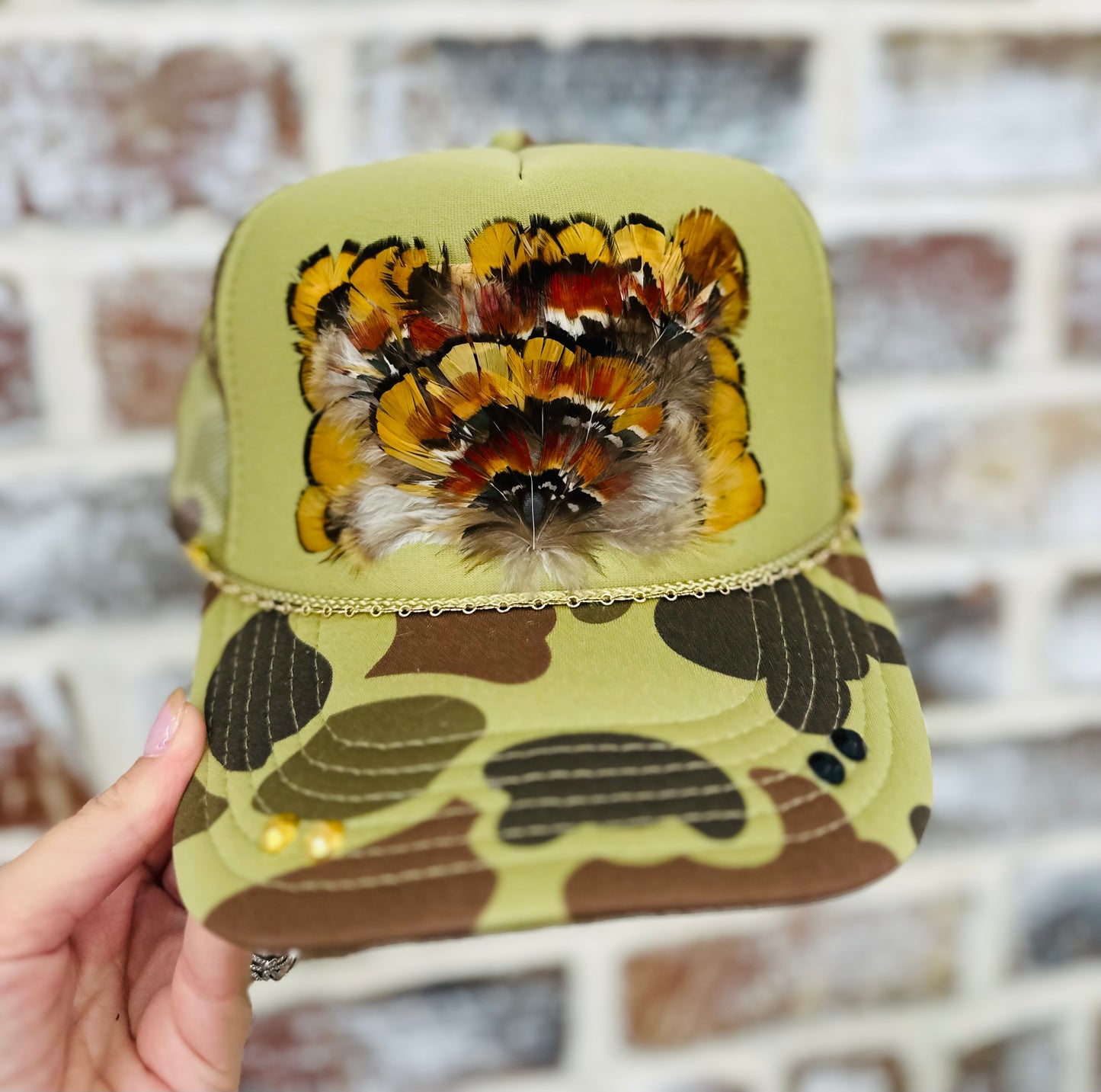 Camo Hat with Orange Feathers