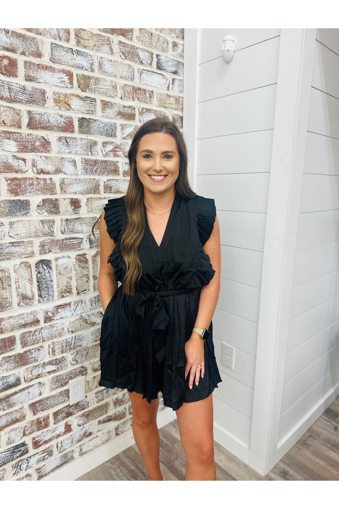 black sleeveless romper with tie at the waist