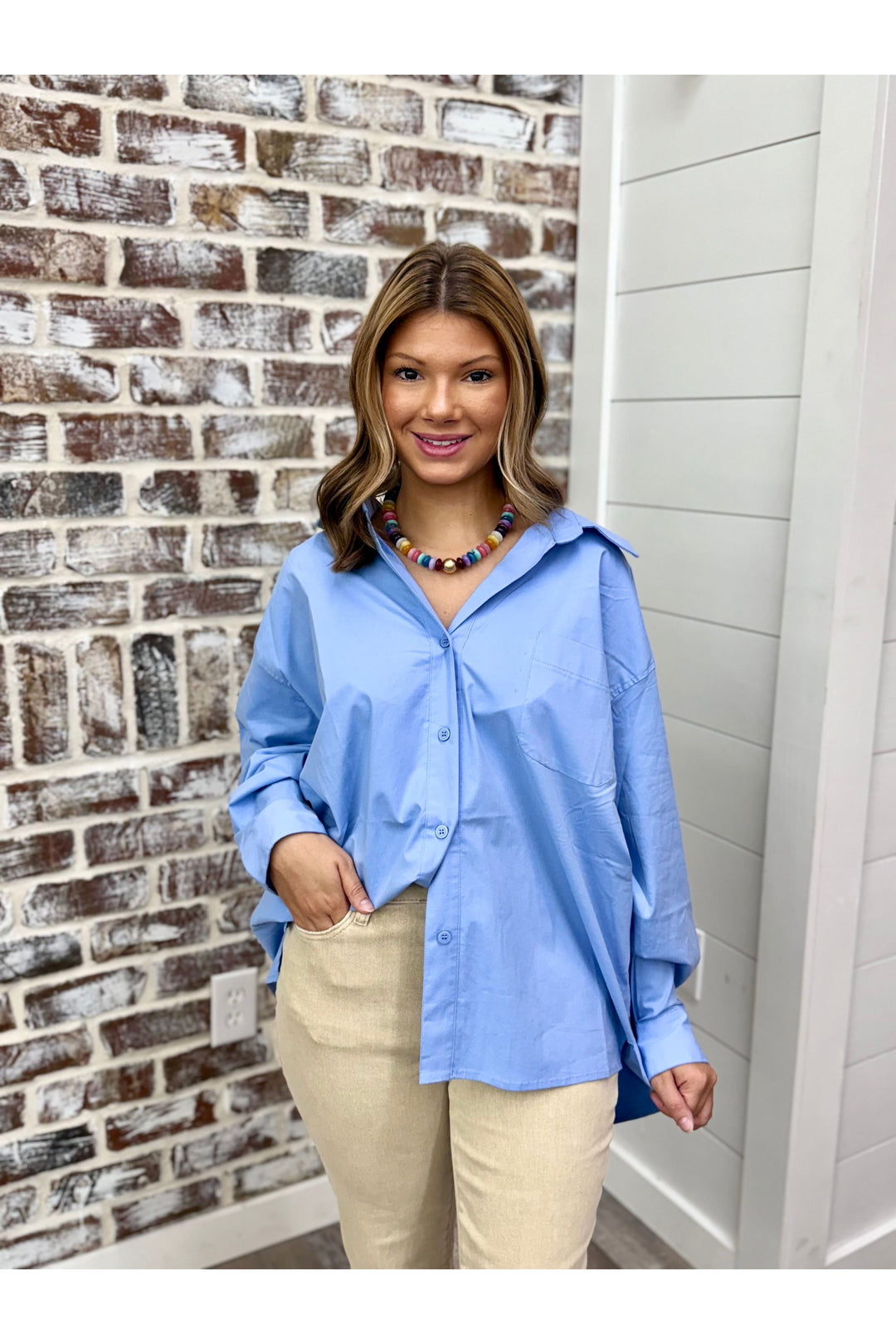 Oversized blue long sleeve button down oxford style top.