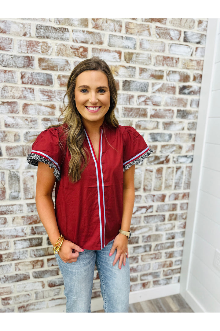 Burgundy top with fringe sleeves