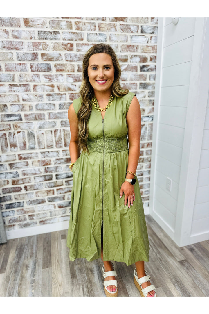sleeveless midi dress, olive in color and sinched waist, leather material