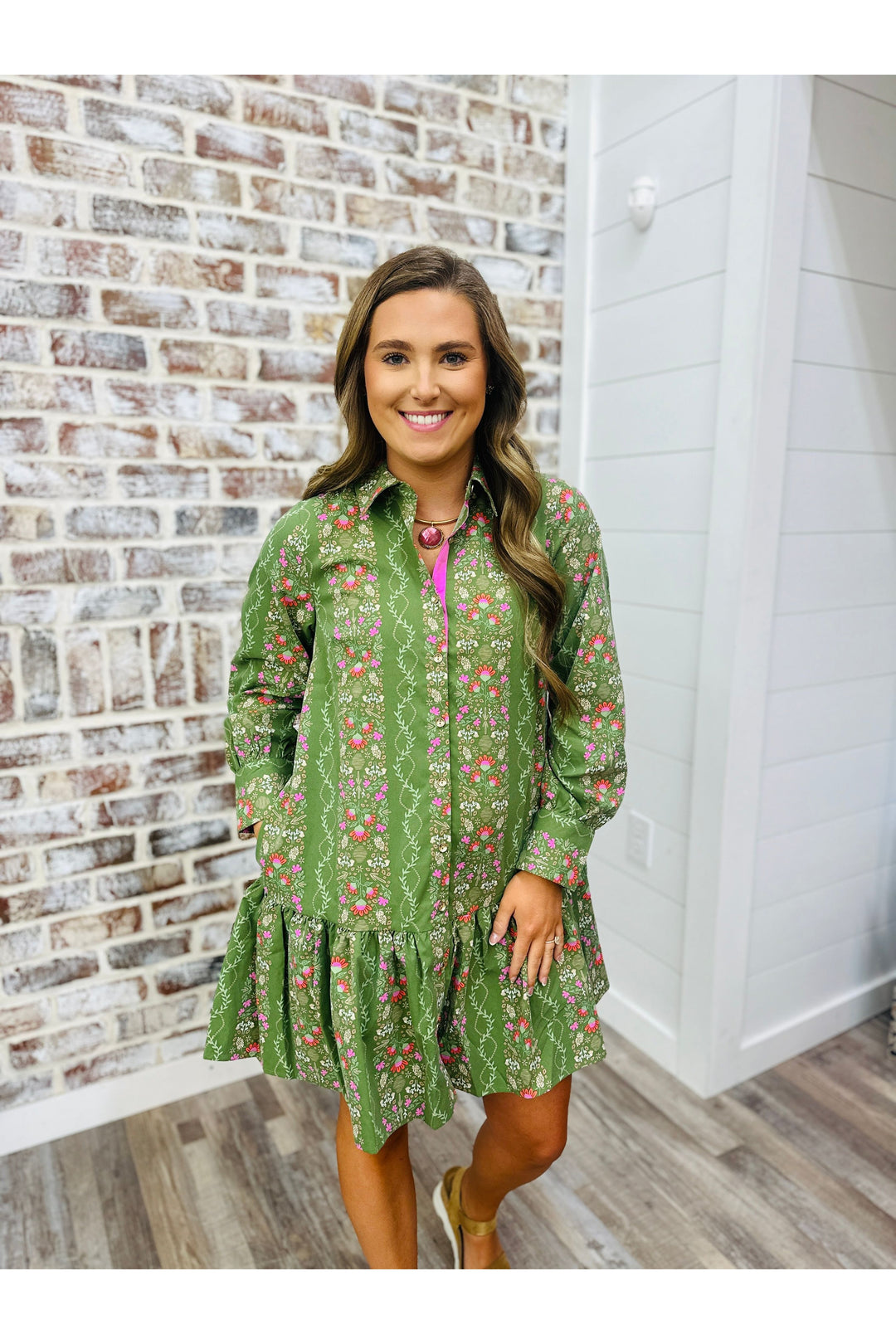 long sleeve green dress with pink floral design, above the knee