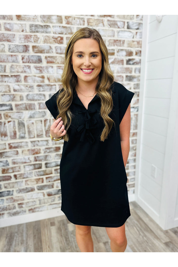 cap sleeve black dress, above the knee