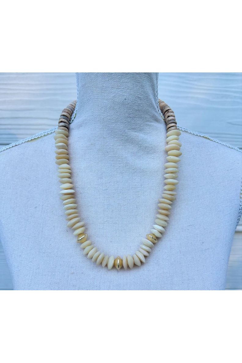 Necklace Made with cream & gold wood and natural beads

Approximately 18”