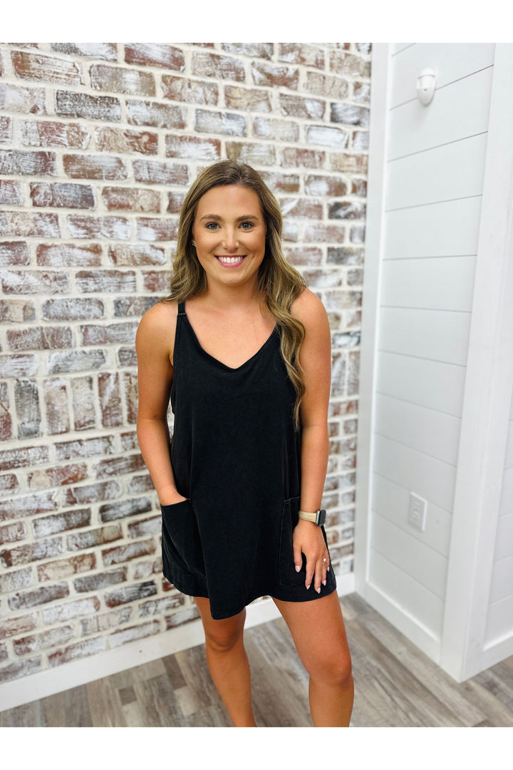 sleeveless black romper with pockets