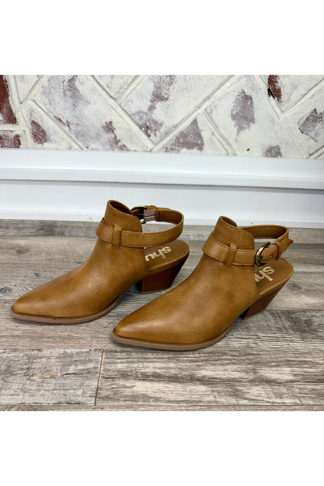 Tan bootie with strap around ankle