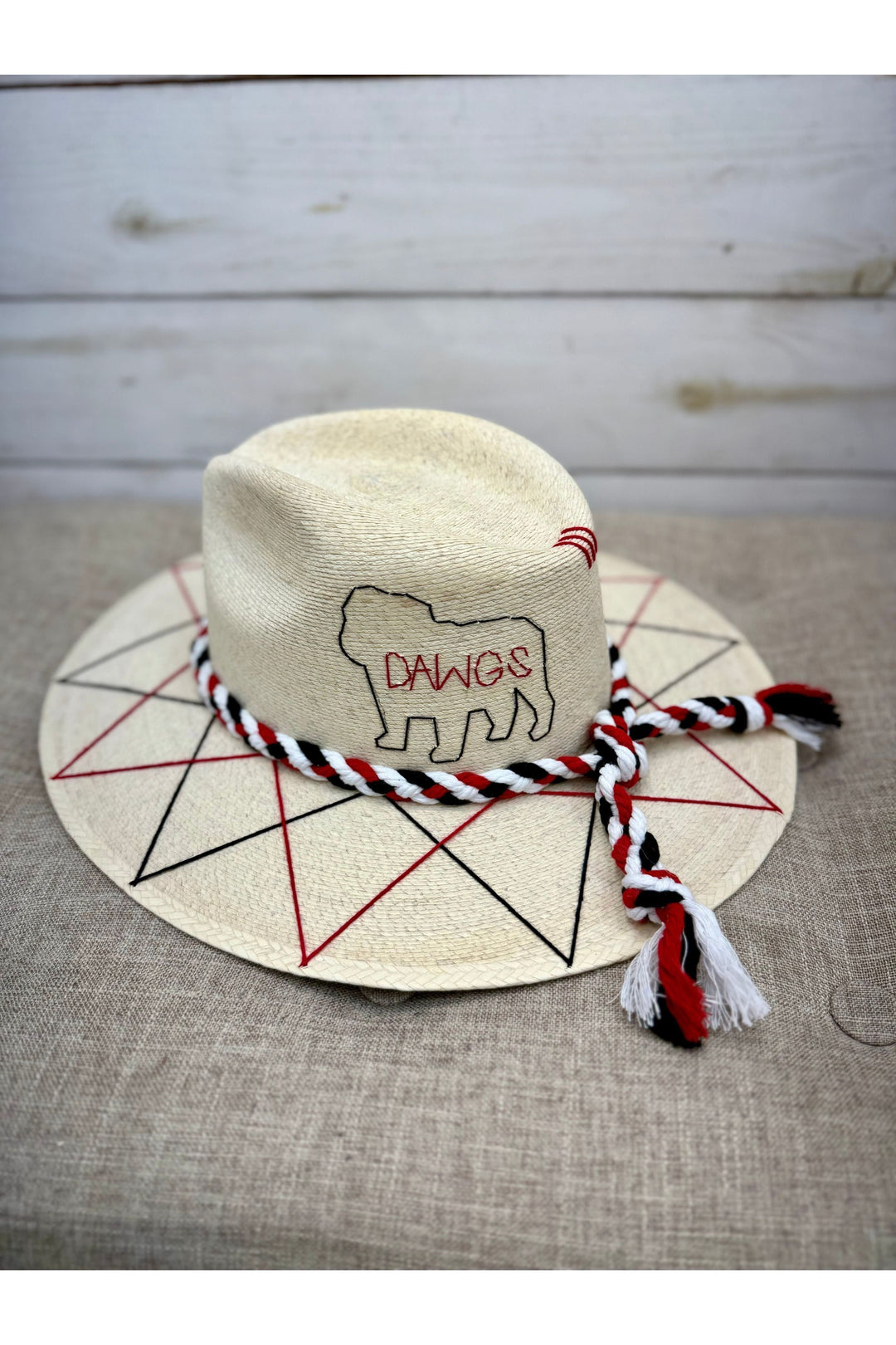 Tan Tipsy Threads brand hat with red and black thread design 