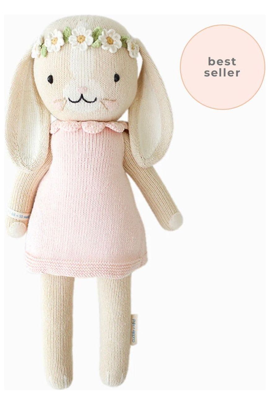 13 inch stuffed bunny toy with a pink mini dress and floral headband.