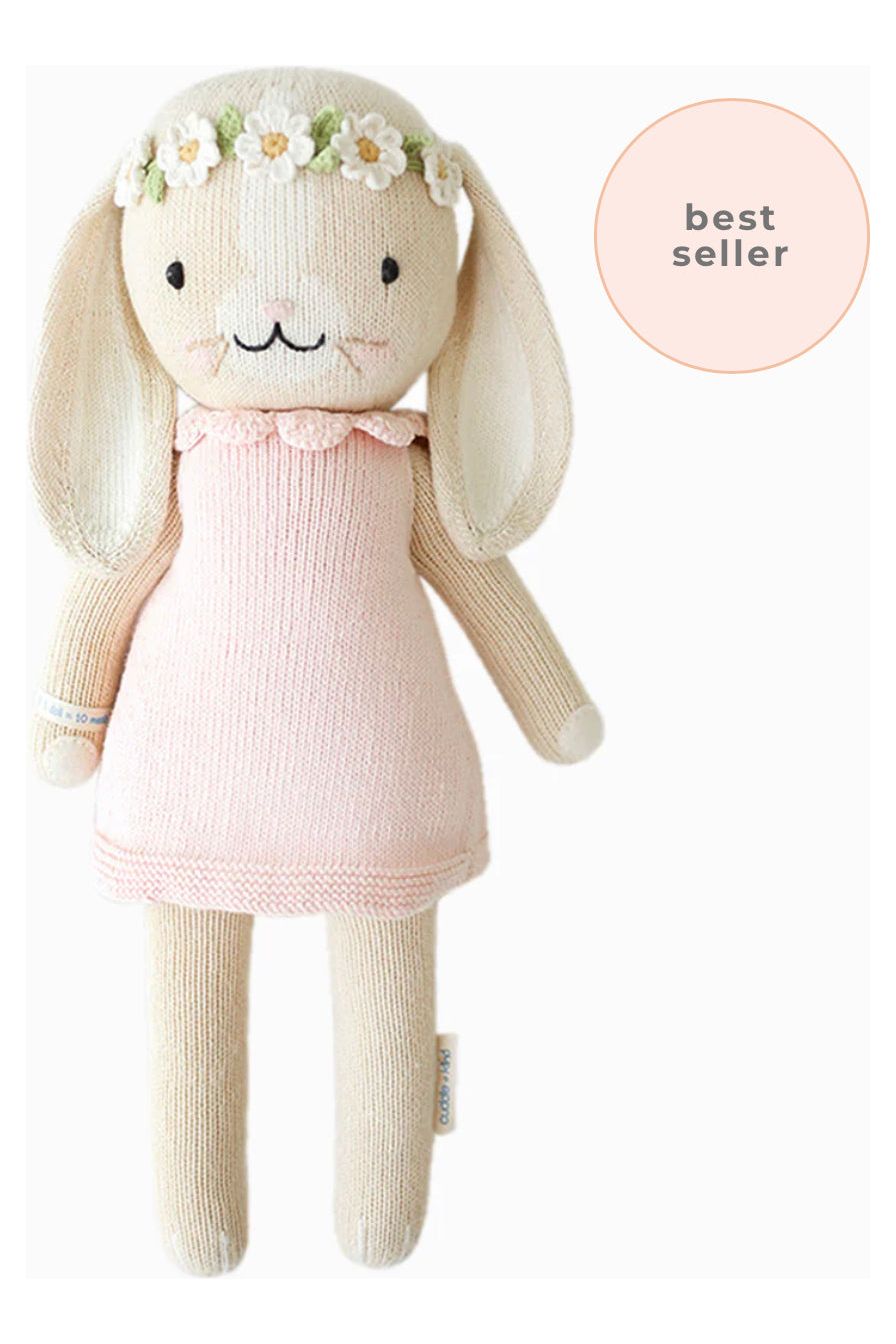 20 inch stuffed bunny with pink dress and floral headband.