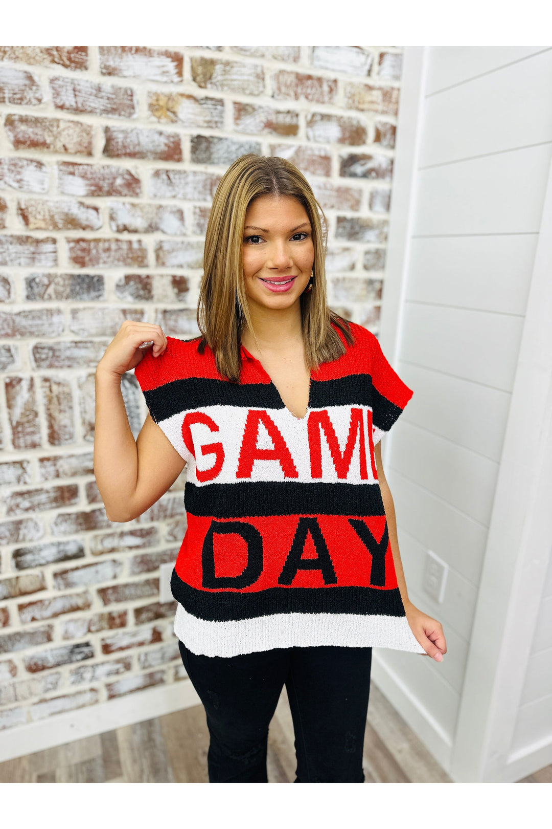 Red white and black stripe shirt with game day written across the front.